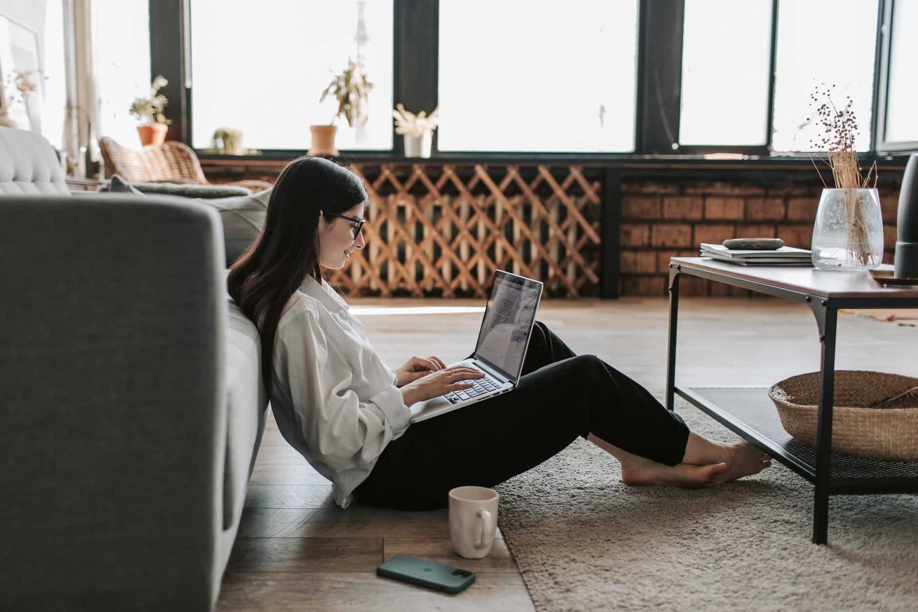 woman working at home with her laptop